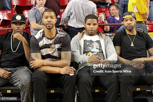 Phoenix Suns players, Markieff Morris and Marcus Morris sit courtside during Arizona State's Pac-12 NCAA basketball game against Utah at Wells Fargo...