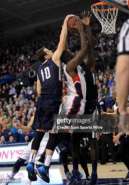 San Diego sophomore guard Duda Sanadze blocks the shot of Gonzaga senior center Sam Dower during the WCC Conference game between the University of...