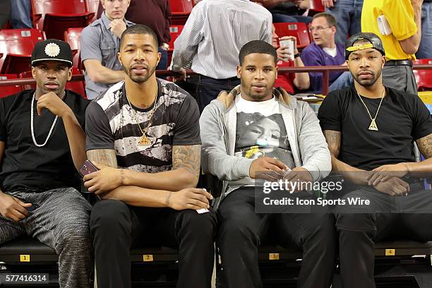 Phoenix Suns players, Markieff Morris and Marcus Morris sit courtside during Arizona State's Pac-12 NCAA basketball game against Utah at Wells Fargo...