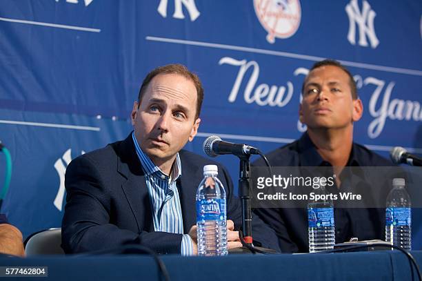 Yankees General Manager Brian Cashman, left, listens as 3B Alex Rodriquez addresses the media about his use of banned substances during a press...