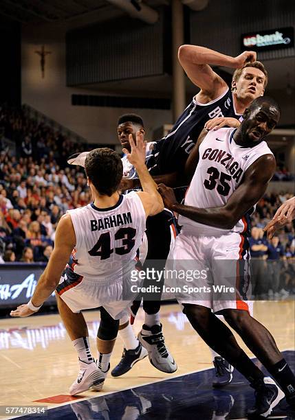 Sophomore guard Kyle Collinsworth collides with Gonzaga senior guard Drew Barham and senior center Sam Dower during the WCC Conference game between...