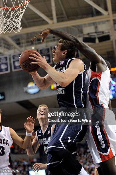 Sophomore guard Kyle Collinsworth goes up for a shot as Gonzaga senior center Sam Dower defends from behind during the WCC Conference game between...