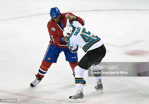 San Jose Sharks' Jody Shelley and Montreal Canadiens' Georges Laraque get 5 minutes penalty for fighting during the first period at the Bell Centre...