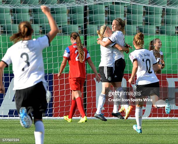 Germans players celebrate there teams first goal by Lena Petermann on right against U.S.A. At the FIFA U-20 Girls World Cup at Commonwealth Stadium...