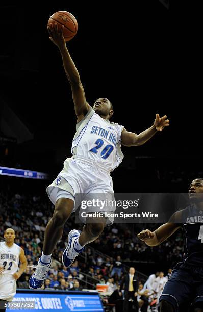 Seton Hall guard Eugene Harvey goes to the basket during the first half of the game as the Huskies defeated the Pirates 62-54 at Prudential Center in...