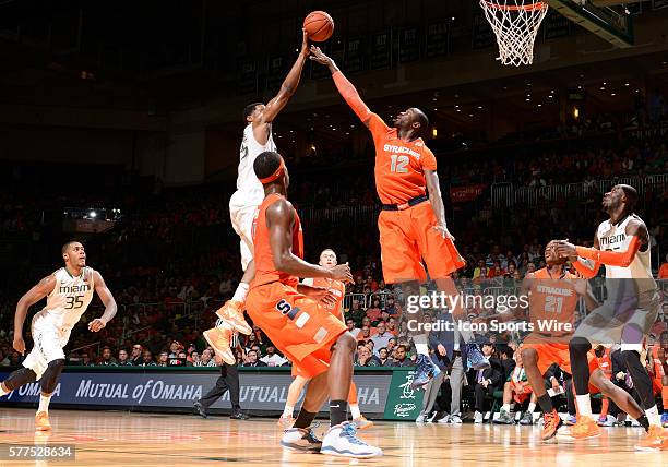 University of Miami guard Garrius Adams shoots against Syracuse University center Baye Moussa Keita in Syracuse's 64-52 victory at BankUnited Center,...