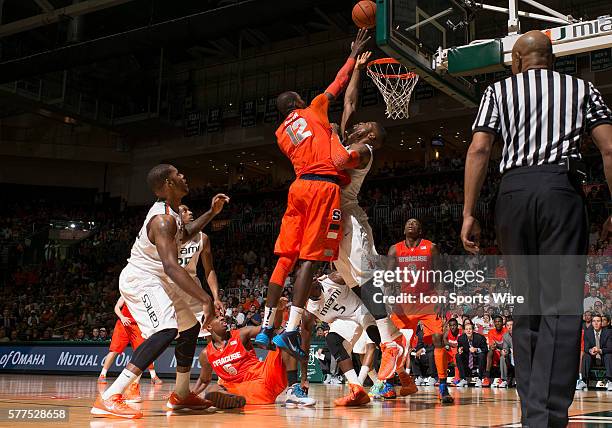 Syracuse University center Baye Moussa Keita shoots against University of Miami forward Raphael Akpejiori in Syracuse's 64-52 victory at BankUnited...