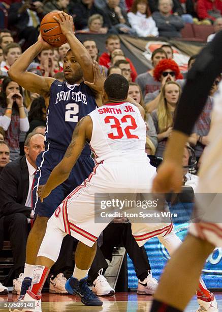 Newbill of the Penn State Nittany Lions with the ball while being guarded by Lenzelle Smith Jr. #32 of the Ohio State Buckeyes during the game...