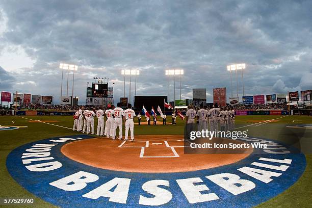 Players of Dominican Republic and Netherlands stand during the national anthem prior to the 2009 World Baseball Classic Pool D game 5 at Hiram...