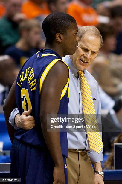 Michigan guard Laval Lucas-Perry has a word with Michigan Wolverines head basketball coach John Beilein during the Illinois Fighting Illini 60-50 win...