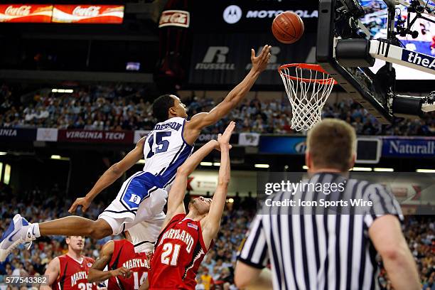 Duke guard/forward Gerald Henderson goes over Maryland guard Greivis Vasquez for the shot in the Duke Blue Devils 67-61 victory over the Maryland...