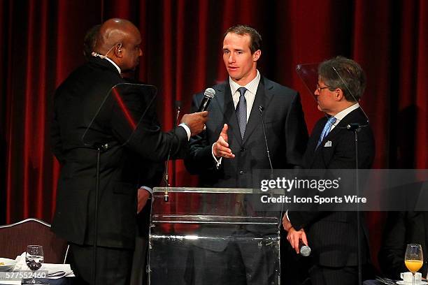 Former N.Y. Giant George Martin, New Orleans Saints Quarterback Drew Brees and author Eric Metaxas during the Athletes In Action 2014 Super Bowl...