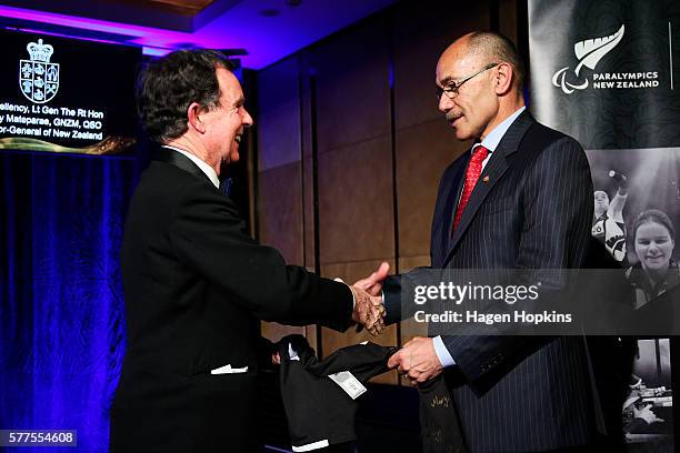 Selwyn Maister presents Governor-General Sir Jerry Mateparae with a gift during the 2016 New Zealand Paralympic Games team presentation at Sky City...