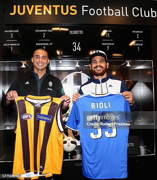David Trezeguet and Hawthorn fc player Cyril Rioli pose during a Juventus FC player visit to the Bourke Street adidas store on July 19, 2016 in...