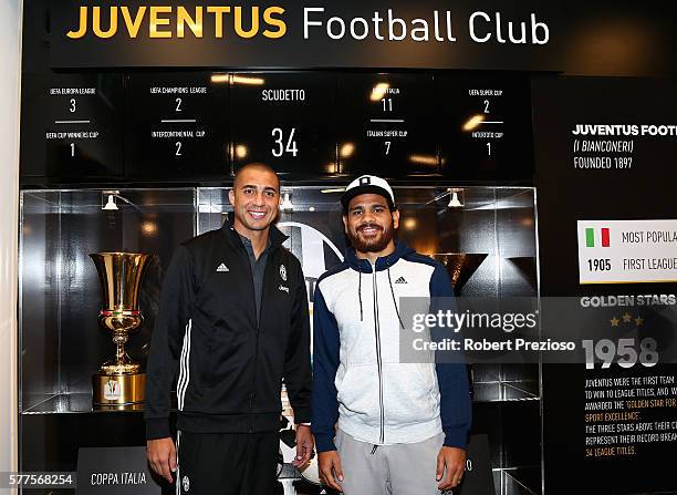 David Trezeguet and Hawthorn fc player Cyril Rioli pose during a Juventus FC player visit to the Bourke Street adidas store on July 19, 2016 in...