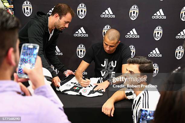 David Trezeguet signs autographs for fans during a Juventus FC player visit to the Bourke Street adidas store on July 19, 2016 in Melbourne,...