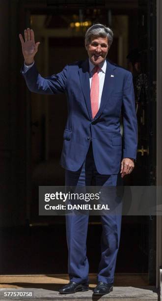 Secretary of State John Kerry gestures as he arrives for a meeting with new British Prime Minister Theresa May, at 10 Downing Street in central...