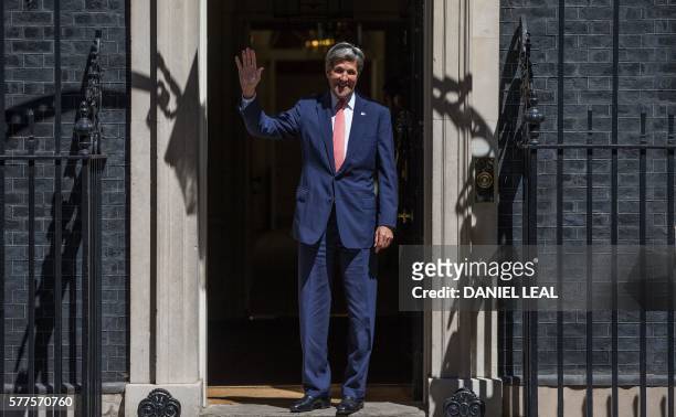 Secretary of State John Kerry gestures as he arrives for a meeting with new British Prime Minister Theresa May, at 10 Downing Street in central...