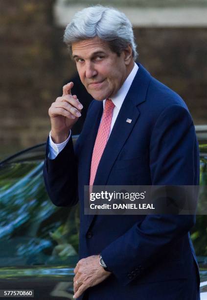Secretary of State John Kerry gestures as he arrives for a meeting with new British Prime Minister Theresa May, at 10 Downing Street in central...