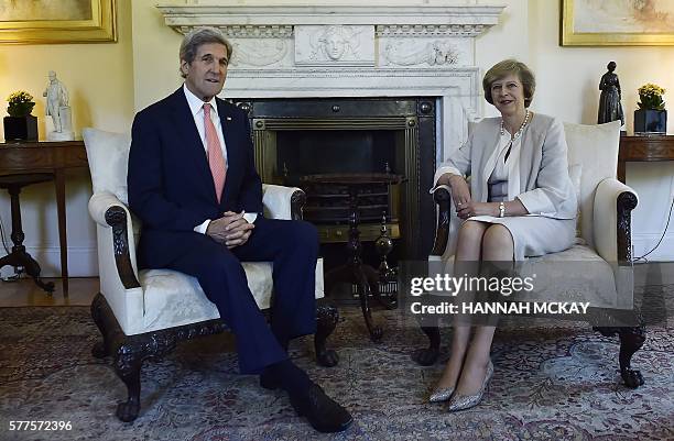 Secretary of State John Kerry and new British Prime Minister Theresa May pose for a photograph inside 10 Downing Street in central London on July 19...