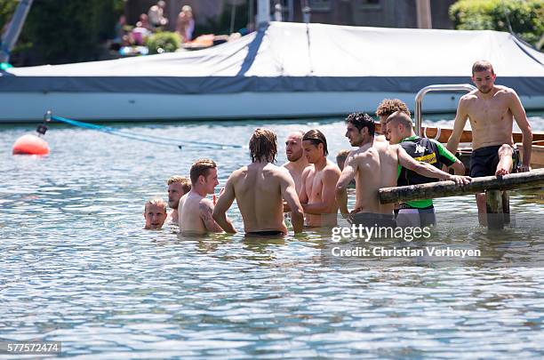 The Players of Borussia swim in the Tegernsee after a training session on day 4 of Borussia Moenchengladbach Training Camp on July 19, 2016 in...