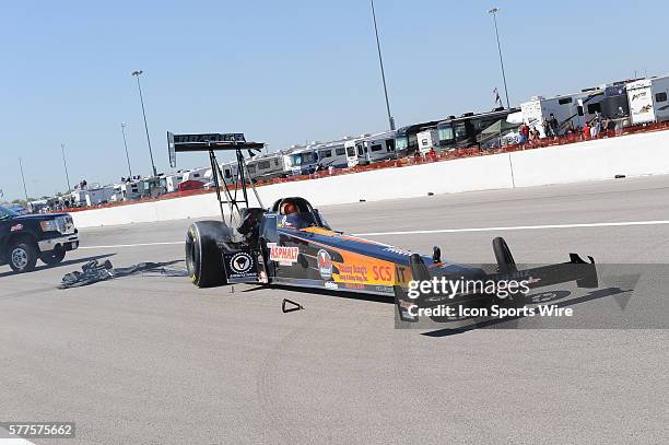 Urs Erbacher NHRA Top Fuel Dragster has a major mechanical problem causing the engine to explode against competitor Larry Dixon during the first...