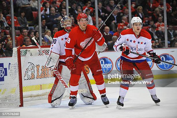 January 31, 2014 - Detroit, MI Washington Capitals goalie Michal Neuvirth tries to look around Detroit Red Wings center Joakim Andersson with...