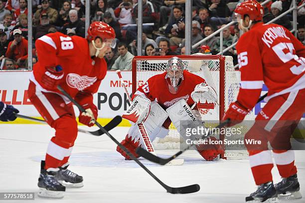 February 3, 2014 - Detroit, MI Detroit Red Wings goalie Jimmy Howard sets up as Detroit Red Wings center Joakim Andersson takes the loose puck during...