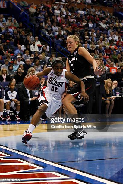 Connecticut guard Kalana Greene drives to the basket around Stanford center Jayne Appel during the UConn Huskies 83-64 win over the Stanford...