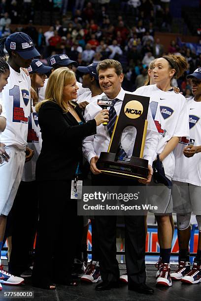 Connecticut Head Coach Geno Auriemma accepts the National Championship trophy after the UConn Huskies 76-54 win over the Louisville Cardinals in the...