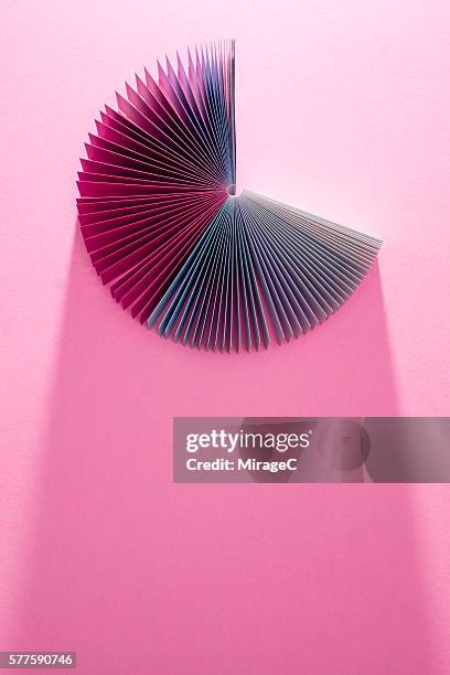 colorful pink paper pages fanned out - aufgefächert stock-fotos und bilder