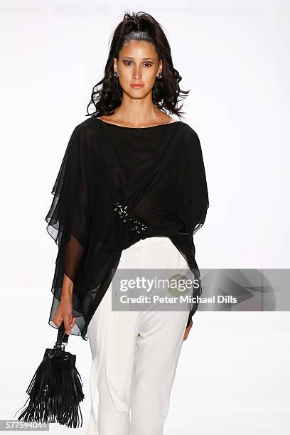 Model walks the runway at the Guido Maria Kretschmer show during the Mercedes-Benz Fashion Week Berlin Spring/Summer 2017 at Erika Hess Eisstadion on...