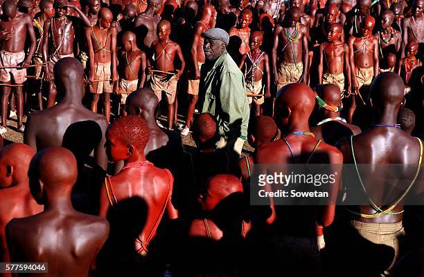 An elder gives last advice to initiates during their graduation ceremony at Sebayeng on July 17, 2016 in Polokwne, South Africa. Provincial chairman...
