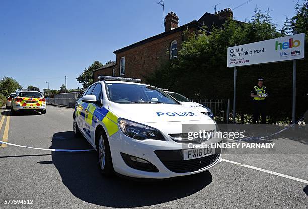 Police cars block the entrance to Castle Swimming Pool at Spalding in Lincolnshire, England on 19th July 2016, where multiple shootings occurred...