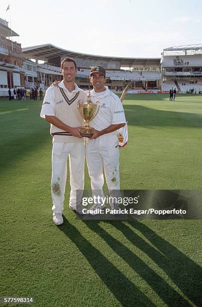 Ben and Adam Hollioake of Surrey with the Benson and Hedges Cup after Surrey win the Benson and Hedges Cup Final between Gloucestershire and Surrey...