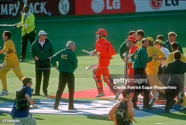 Neil Johnson of Zimbabwe runs off the field at the end of the World Cup Super Six match between Australia and Zimbabwe at Lord's Cricket Ground,...