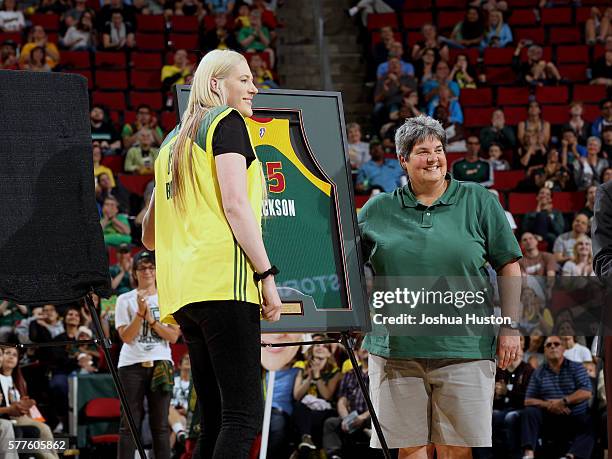 Retired WNBA player Lauren Jackson is honored during a ceremony retiring her No. 15 jersey which became the first jersey retired by the Storm at Key...