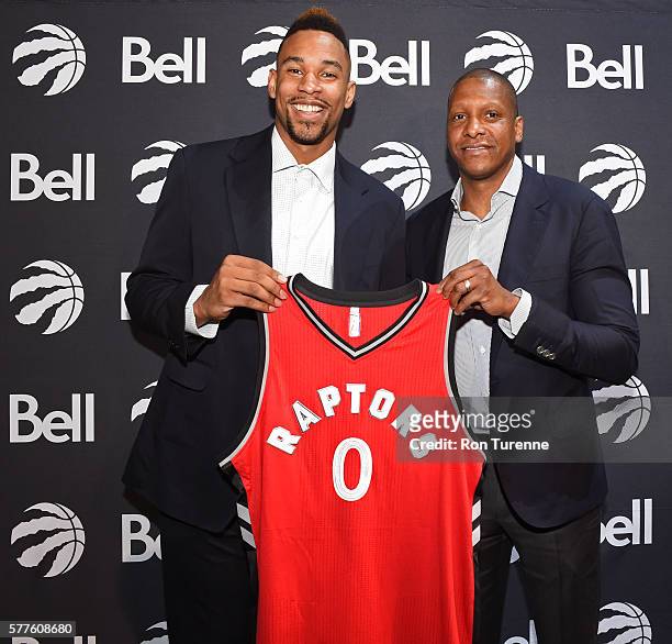 Jared Sullinger and Masai Ujiri of the Toronto Raptors pose for a photo during a press conference after announcing his new deal on July 14, 2016 at...