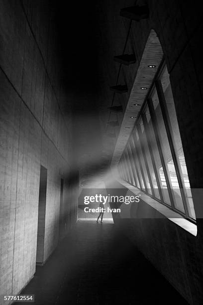 sunlight falling on silhouetted of people in a modern room - city of los angeles architecture stock pictures, royalty-free photos & images