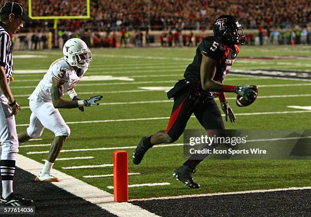 Texas cornerback Curtis Brown defends as Texas Tech wide receiver Michael Crabtree catches scores the game winning touchdown during Texas Tech's...