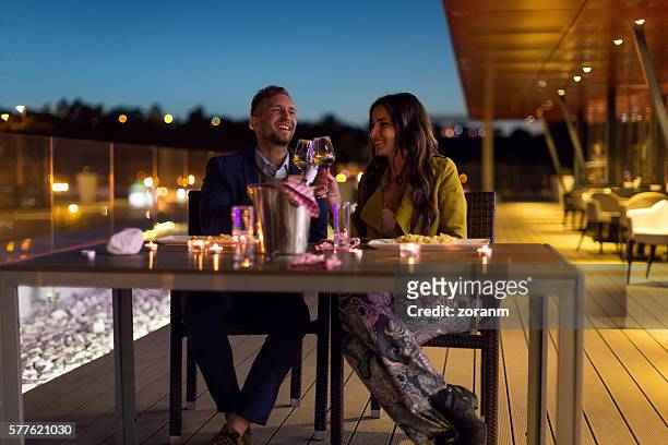 wine toast at night - date night stock pictures, royalty-free photos & images