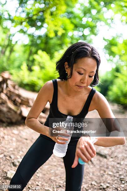 woman refreshment herself on the nature after have been hiking - pictures of containers seized by customs stock pictures, royalty-free photos & images
