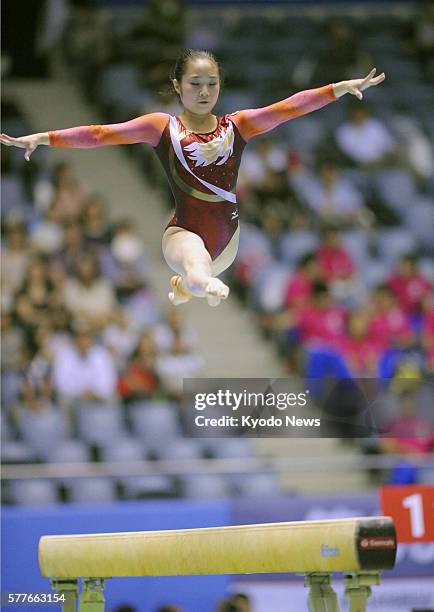 Japan - Koko Tsurumi performs on the balance beam on June 12 the final day of the NHK Cup at Yoyogi National Stadium in Tokyo. She captured her third...