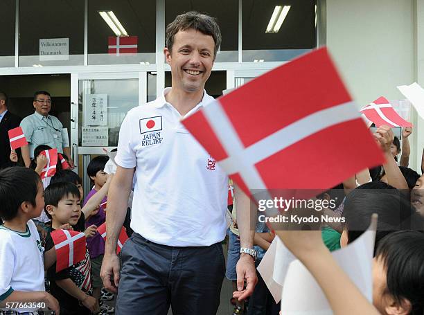 Japan - Danish Crown Prince Frederik meets elementary school children in Higashimatsushima, Miyagi Prefecture, on June 14, 2011. The area was...