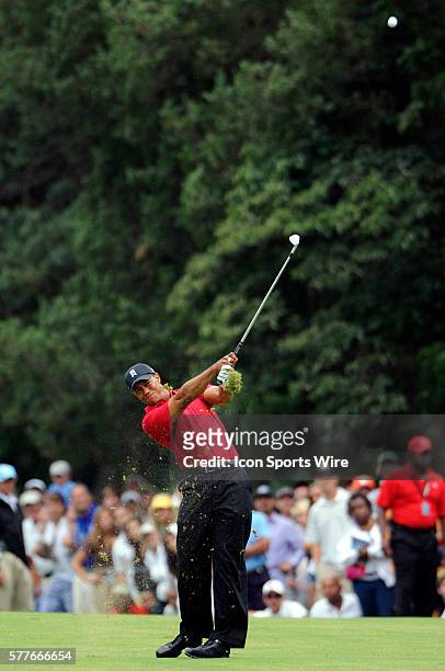 Tiger Woods hits his second shot from the fairway on the 18th hole in the final round of the AT&T National PGA event hosted by Woods at Congressional...