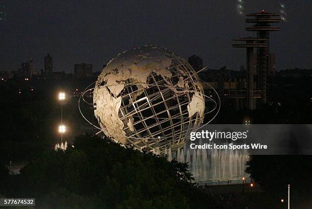 The sun setting during the 2009 US Open over the Worlds Fair Globe in Flushing Meadow Park from Arthur Ashe Stadium at the USTA Tennis Center in...