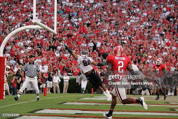 South Carolina tight end Weslye Saunders has the pass just over his head as Georgia linebacker Marcus Dowtin defends in the Georgia Bulldogs 41-37...