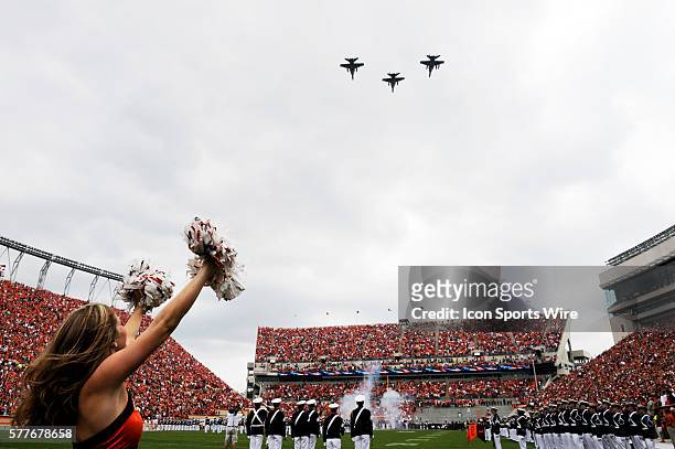 Virginia Tech Cheerleader with the Navy flyover during the Hokies 16-15 win over the Nebraska Huskers at Worsham Field at Lane Stadium in Blacksburg,...