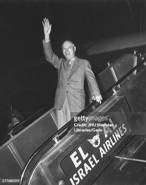 William Foxwell Albright, Candid photograph, Albright waving from plane boarding ramp, El Al airlines jet, c 57 years of age, 1950.