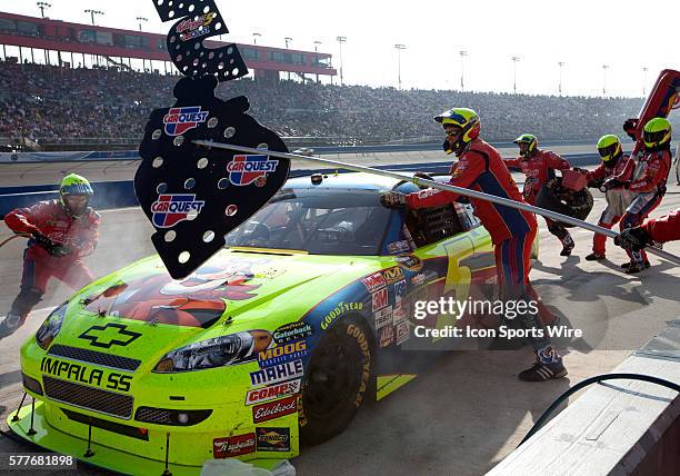 Mark Martin driver of the Kellogg's / Carquest Chevrolet makes a pit stop during the NASCAR Sprint Cup Series - Pepsi 500 at the Auto Club Speedway...